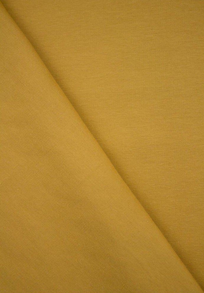 Tissu molleton de couleur jaune moutarde pour coudre un sweat